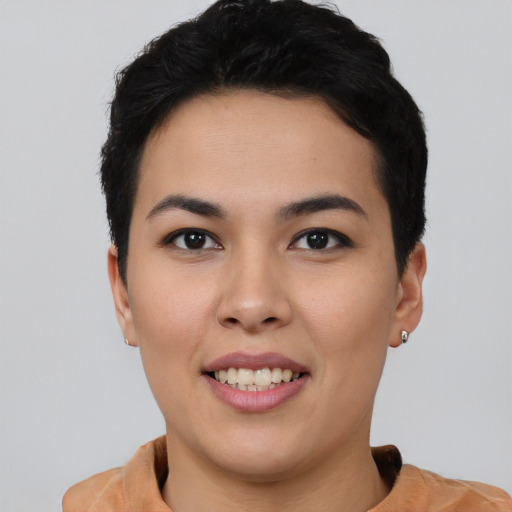 Joyful asian young-adult female with short  black hair and brown eyes