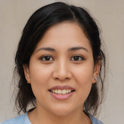 Joyful asian young-adult female with medium  brown hair and brown eyes