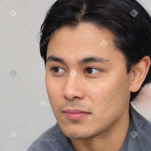 Neutral white young-adult male with short  black hair and brown eyes