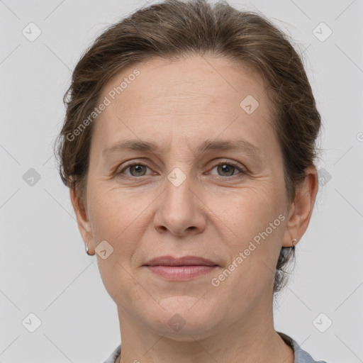 Joyful white adult female with short  brown hair and grey eyes