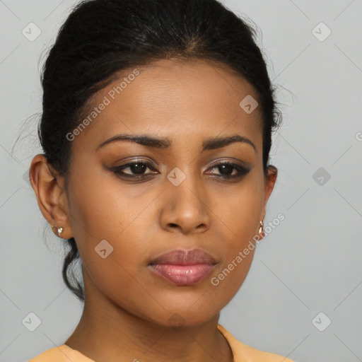 Joyful latino young-adult female with medium  brown hair and brown eyes