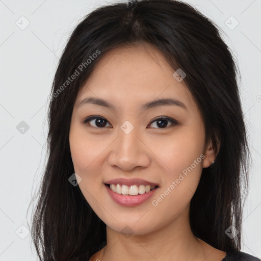 Joyful asian young-adult female with long  brown hair and brown eyes