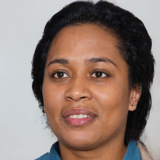 Joyful black young-adult female with medium  black hair and brown eyes
