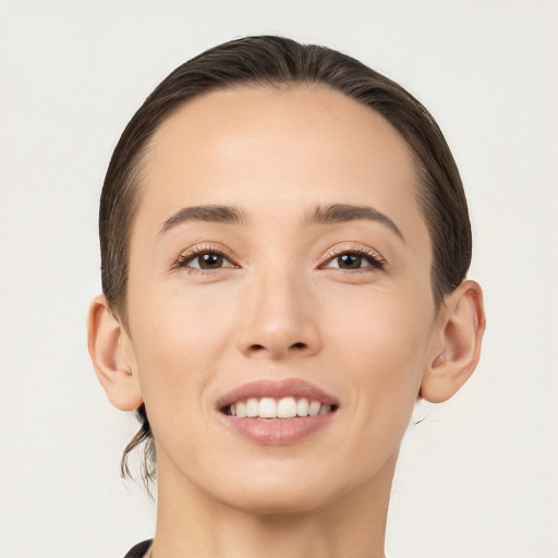 Joyful white young-adult female with medium  brown hair and brown eyes