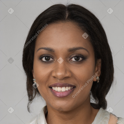 Joyful black young-adult female with medium  brown hair and brown eyes