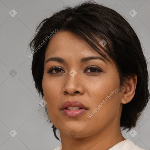 Joyful asian young-adult female with medium  black hair and brown eyes