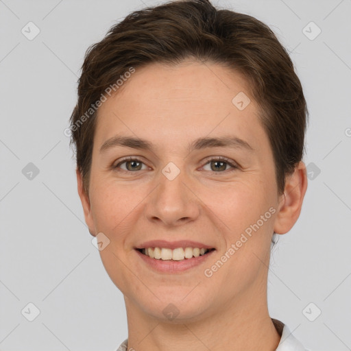 Joyful white young-adult female with short  brown hair and brown eyes