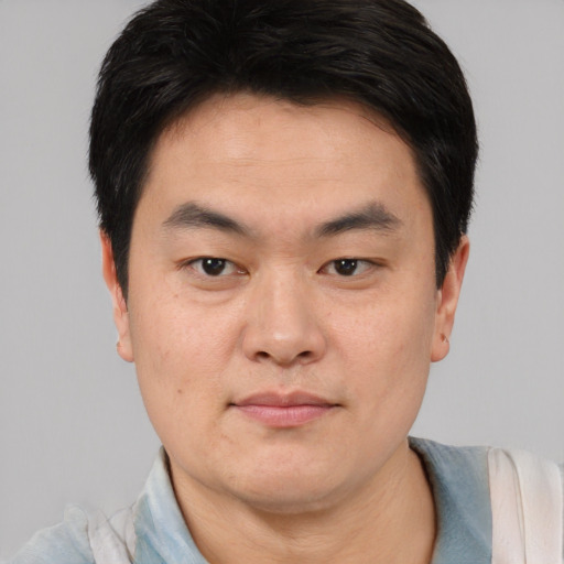 Neutral asian young-adult male with short  black hair and brown eyes