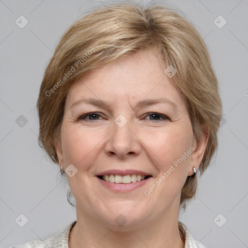 Joyful white adult female with medium  brown hair and grey eyes