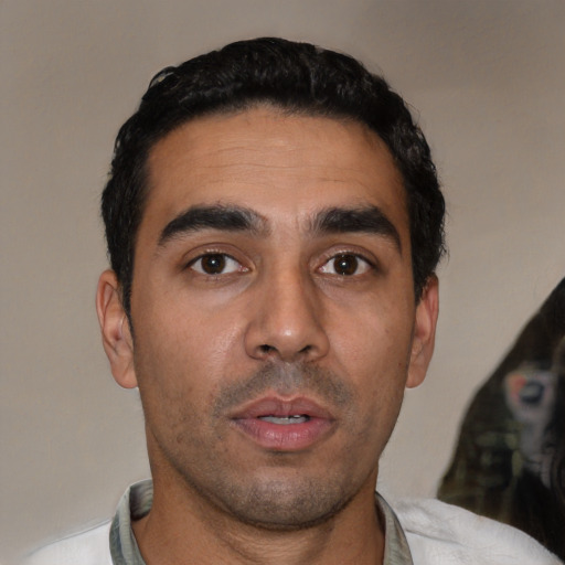 Neutral latino young-adult male with short  black hair and brown eyes