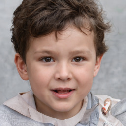 Joyful white child male with short  brown hair and brown eyes