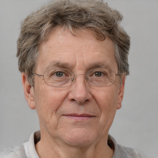 Joyful white middle-aged male with short  brown hair and grey eyes