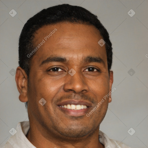 Joyful black young-adult male with short  brown hair and brown eyes