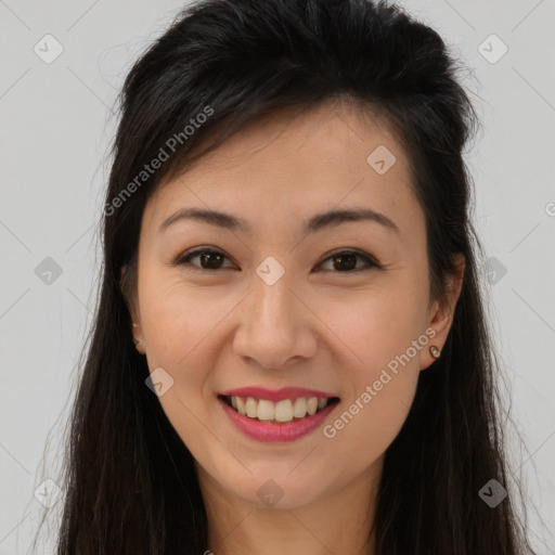 Joyful asian young-adult female with long  brown hair and brown eyes