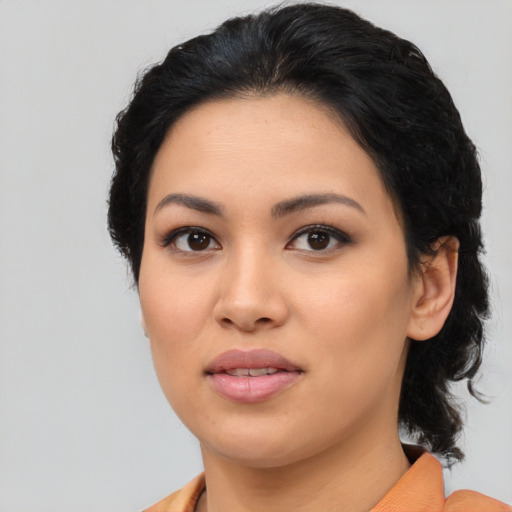 Joyful asian young-adult female with medium  black hair and brown eyes