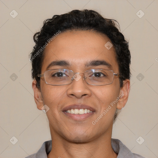 Joyful latino adult male with short  brown hair and brown eyes