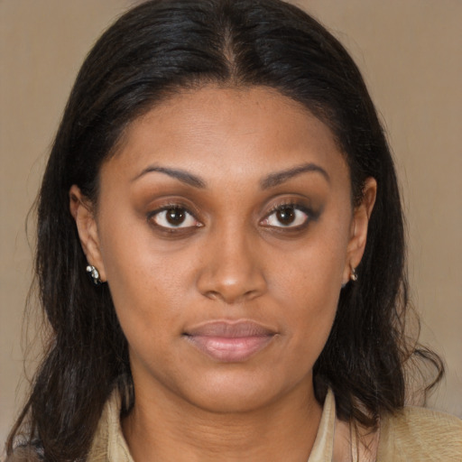 Joyful latino young-adult female with medium  brown hair and brown eyes