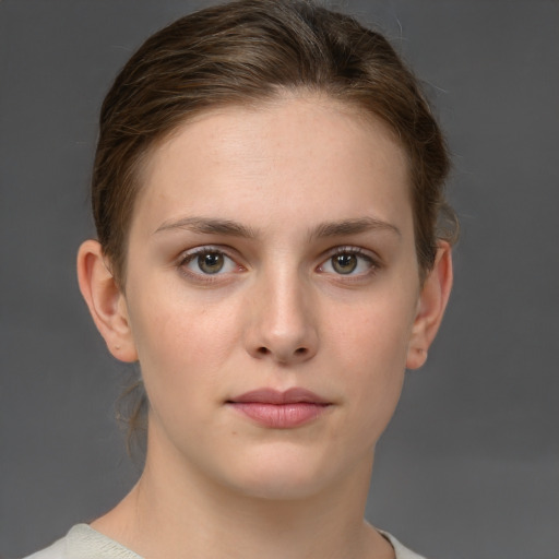 Neutral white young-adult female with short  brown hair and brown eyes