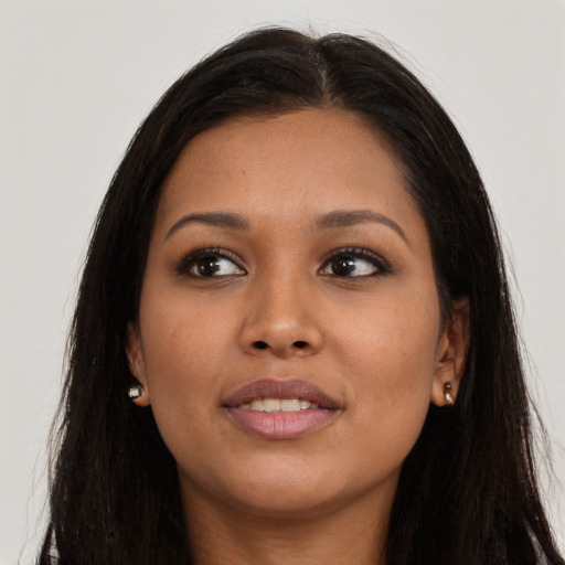 Joyful asian young-adult female with long  brown hair and brown eyes