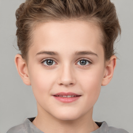 Joyful white child female with short  brown hair and grey eyes