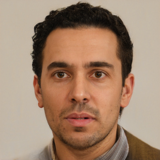 Neutral white young-adult male with short  black hair and brown eyes