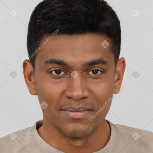 Joyful black young-adult male with short  black hair and brown eyes