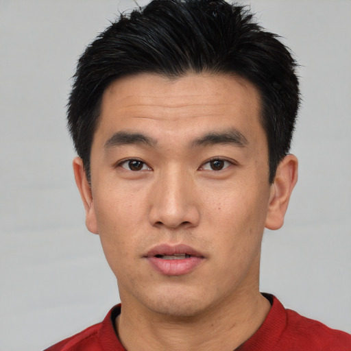 Neutral asian young-adult male with short  black hair and brown eyes