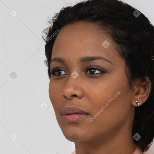 Neutral black young-adult female with medium  black hair and brown eyes