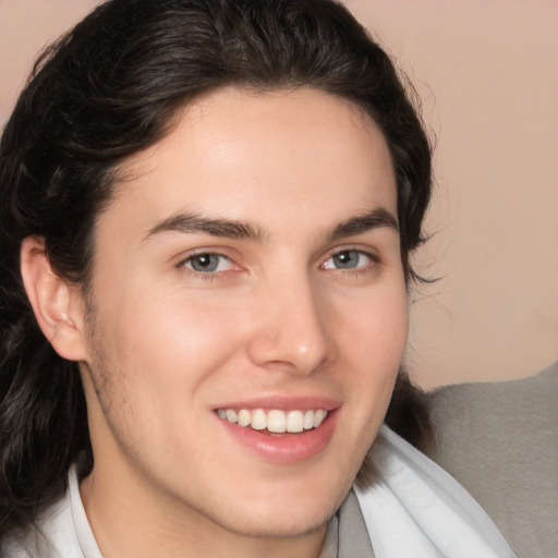 Joyful white young-adult male with medium  brown hair and brown eyes