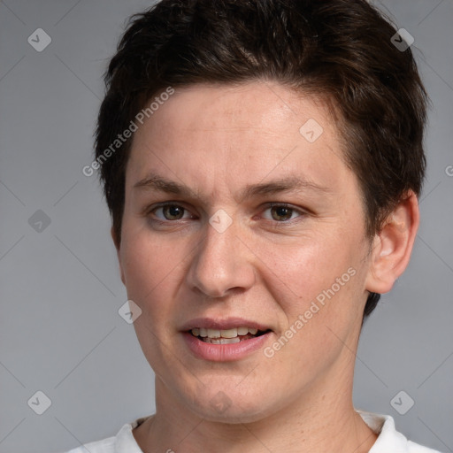 Joyful white adult male with short  brown hair and brown eyes