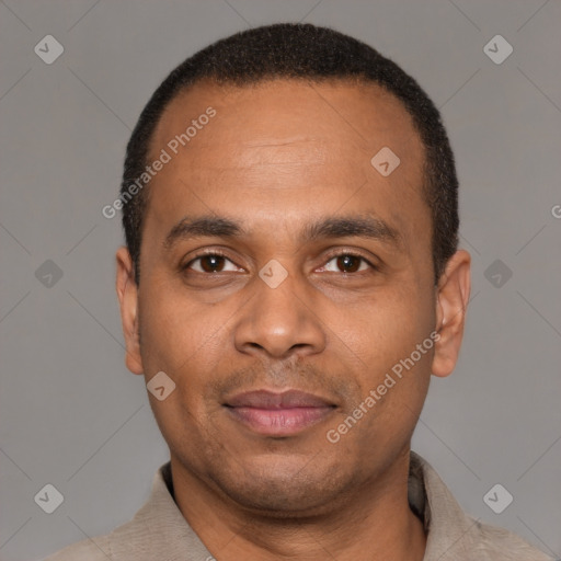 Joyful latino adult male with short  black hair and brown eyes