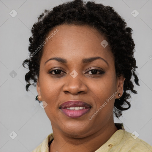 Joyful black adult female with short  brown hair and brown eyes