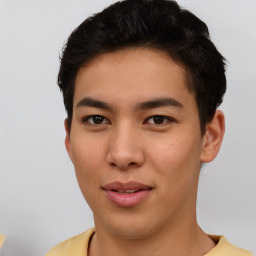 Joyful asian young-adult male with short  black hair and brown eyes