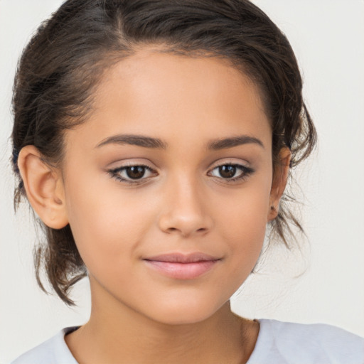 Joyful white child female with medium  brown hair and brown eyes