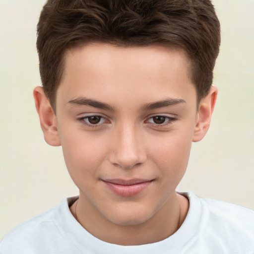 Joyful white child male with short  brown hair and brown eyes