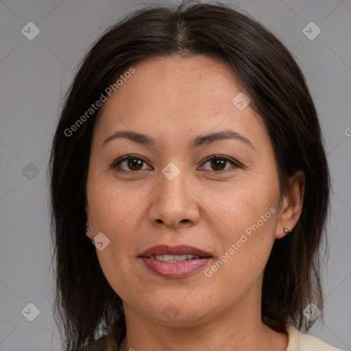 Joyful white adult female with medium  brown hair and brown eyes