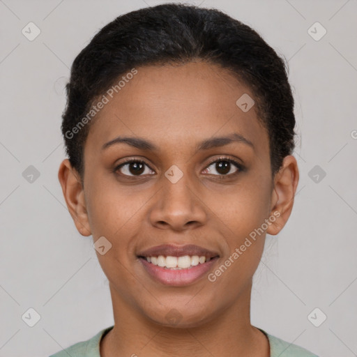 Joyful latino young-adult female with short  brown hair and brown eyes