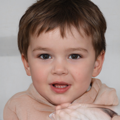 Joyful white child male with short  brown hair and brown eyes