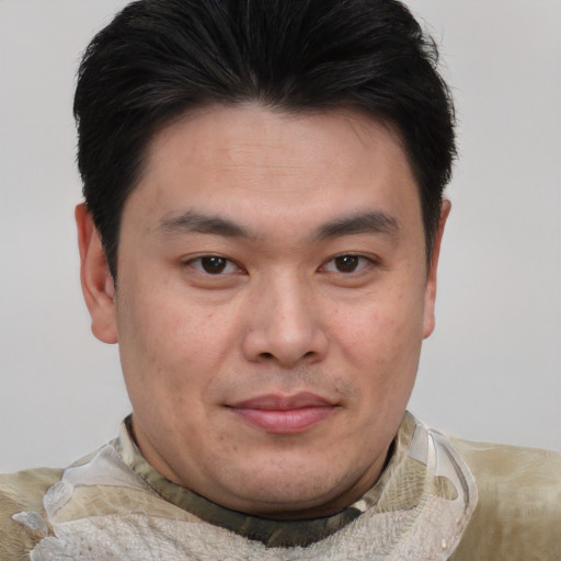 Joyful asian young-adult male with short  brown hair and brown eyes