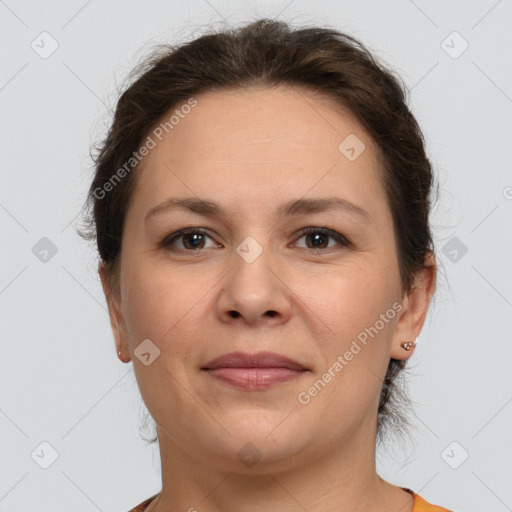 Joyful white adult female with short  brown hair and grey eyes