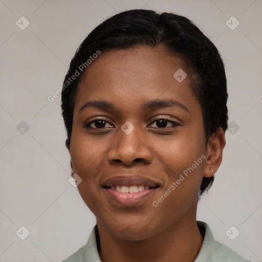 Joyful black young-adult female with short  black hair and brown eyes