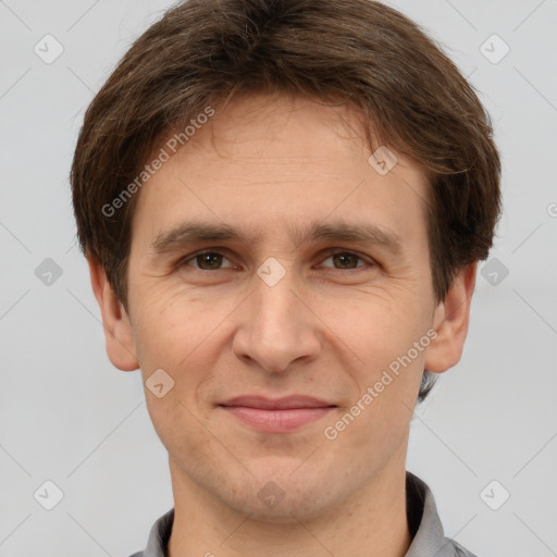 Joyful white adult male with short  brown hair and brown eyes