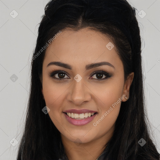 Joyful latino young-adult female with long  brown hair and brown eyes