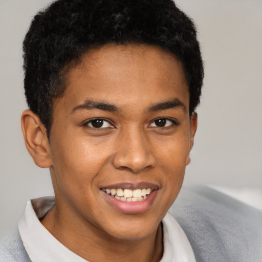 Joyful black young-adult male with short  brown hair and brown eyes