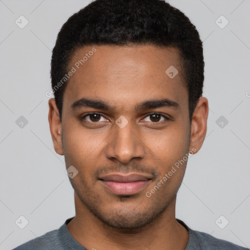 Joyful black young-adult male with short  black hair and brown eyes