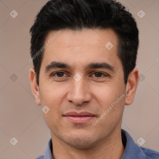 Joyful white young-adult male with short  black hair and brown eyes