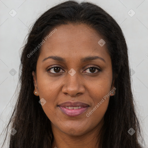 Joyful black young-adult female with long  brown hair and brown eyes