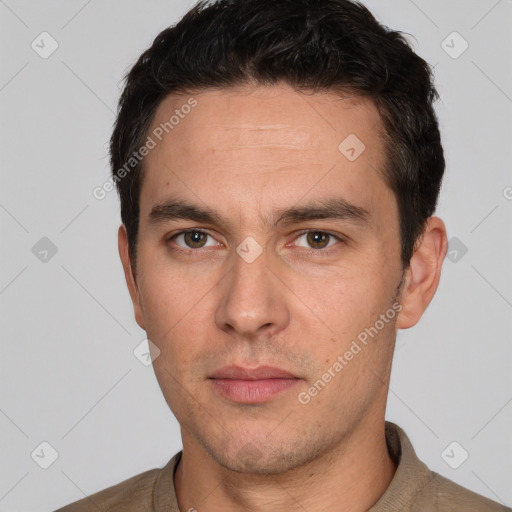 Neutral white adult male with short  black hair and brown eyes