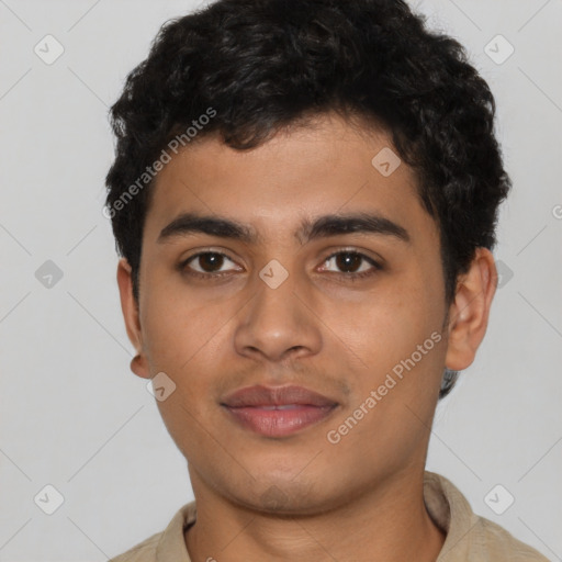 Joyful latino young-adult male with short  brown hair and brown eyes