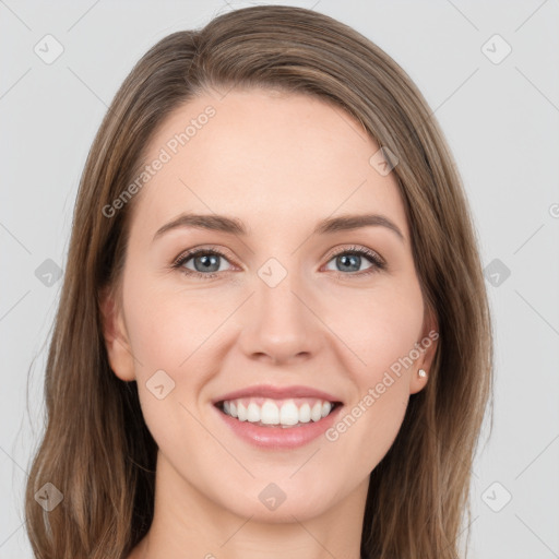 Joyful white young-adult female with long  brown hair and grey eyes